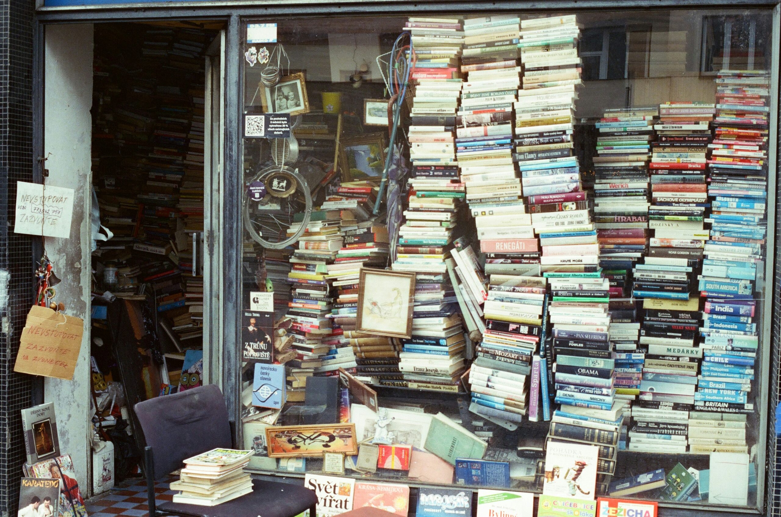 storefront with window stacked with books