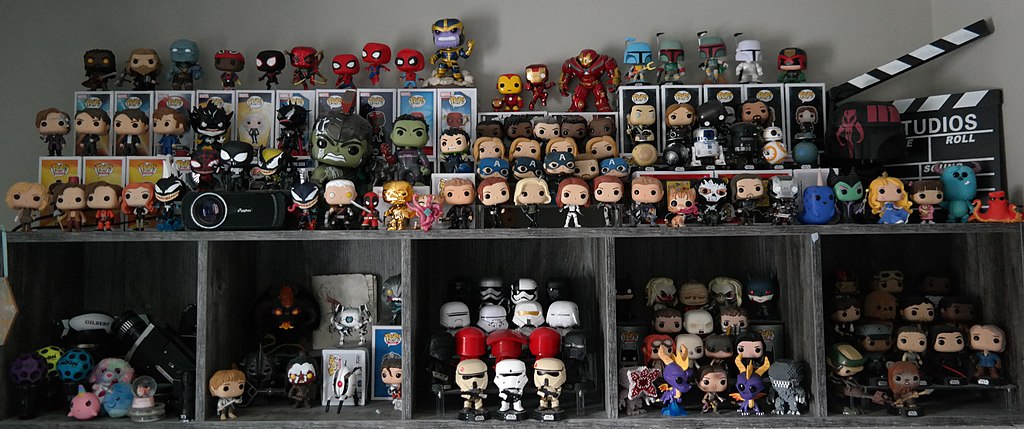 A collection of out of box Funko Pop figurines and bobbleheads