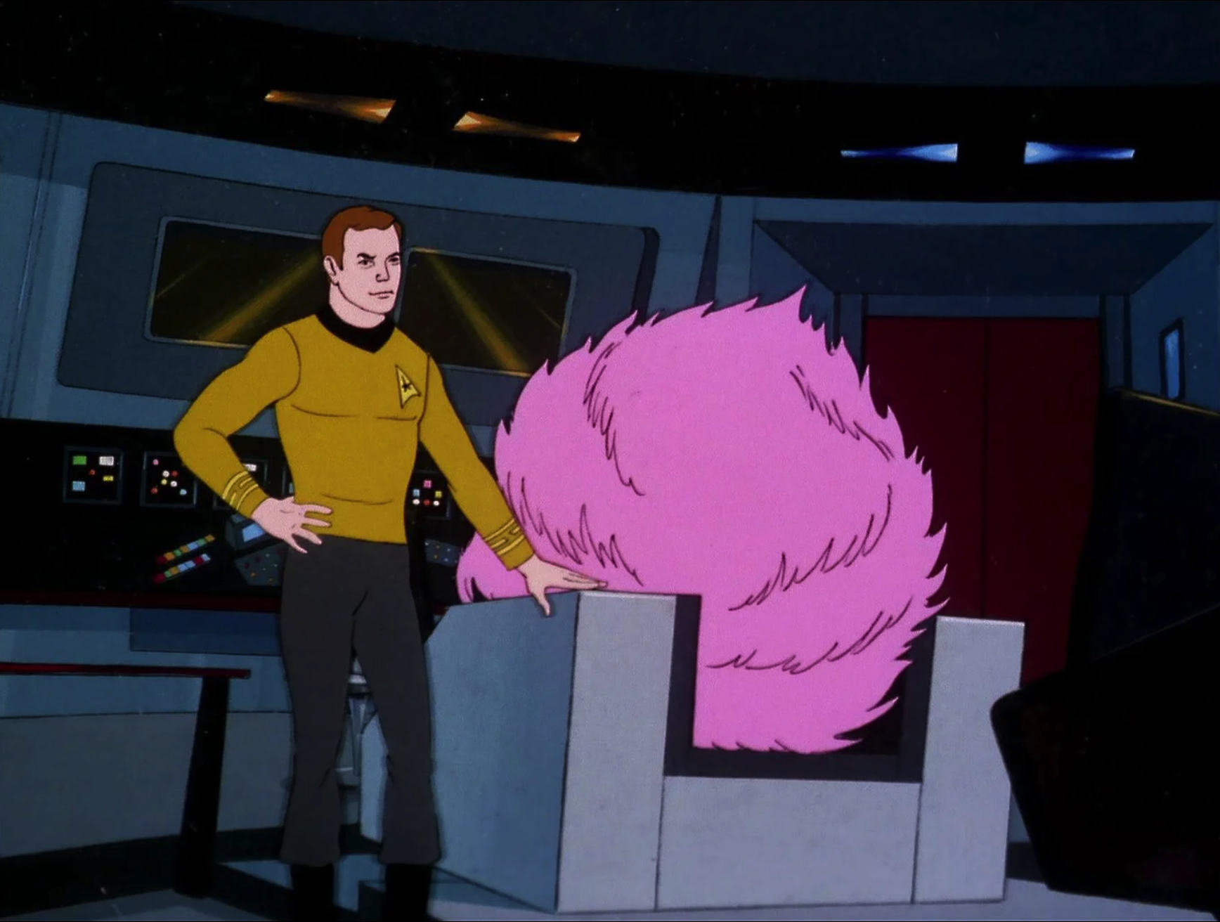 Animation cel of Captain Kirk next to giant tribble