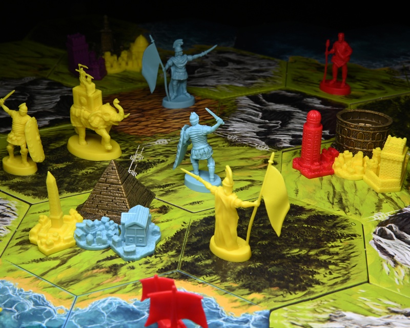 Clash of Cultures board in play with warriors on a map surrounding cities