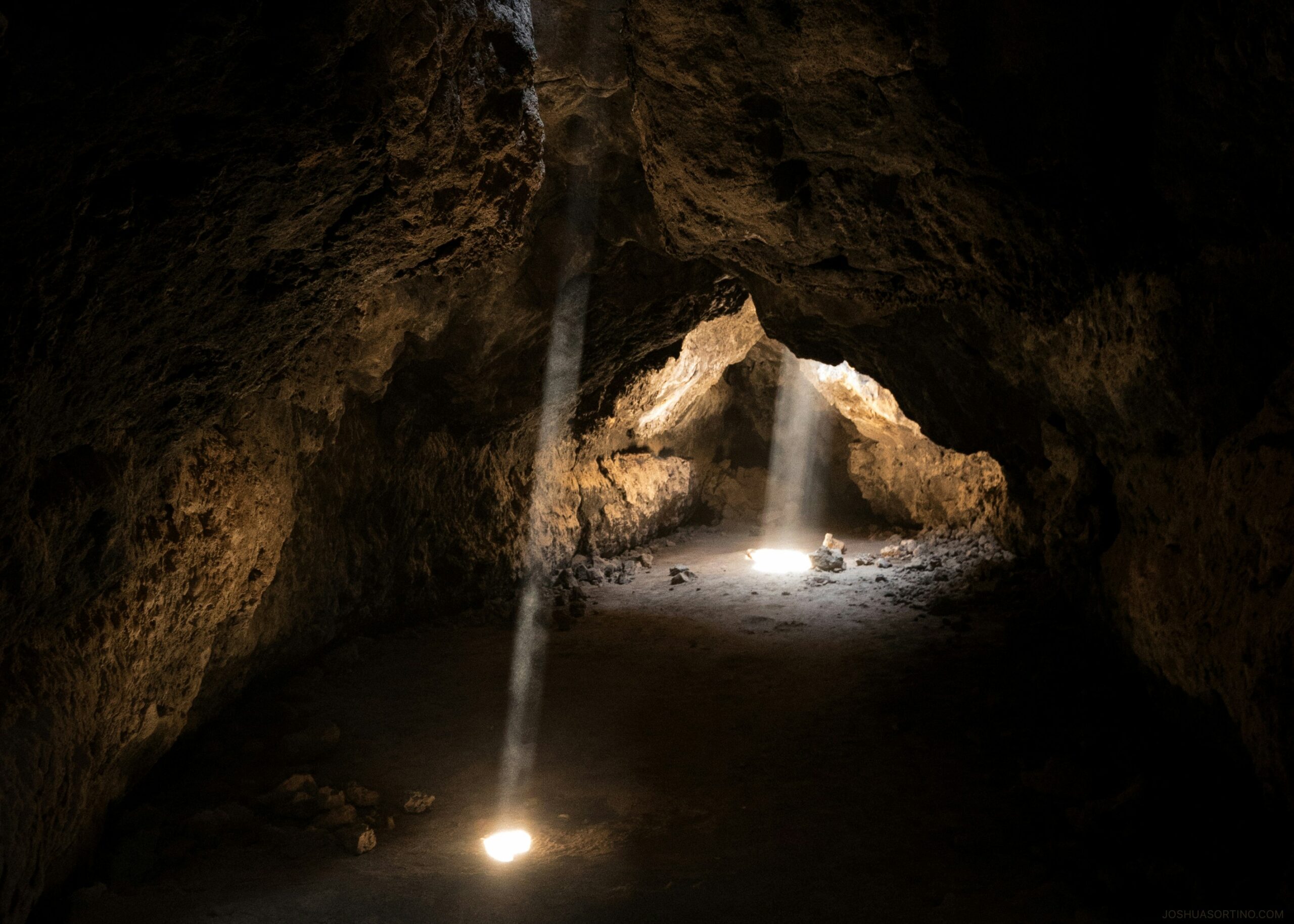 sunlight dropping into a cavern