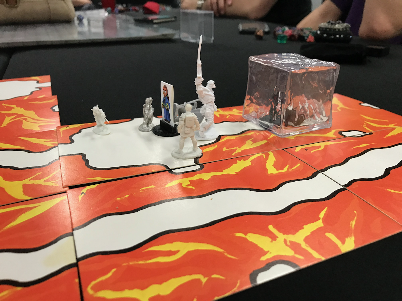 5e minis and a gelatinous cube mini on cavern tiles from The Sorcerer's Cave