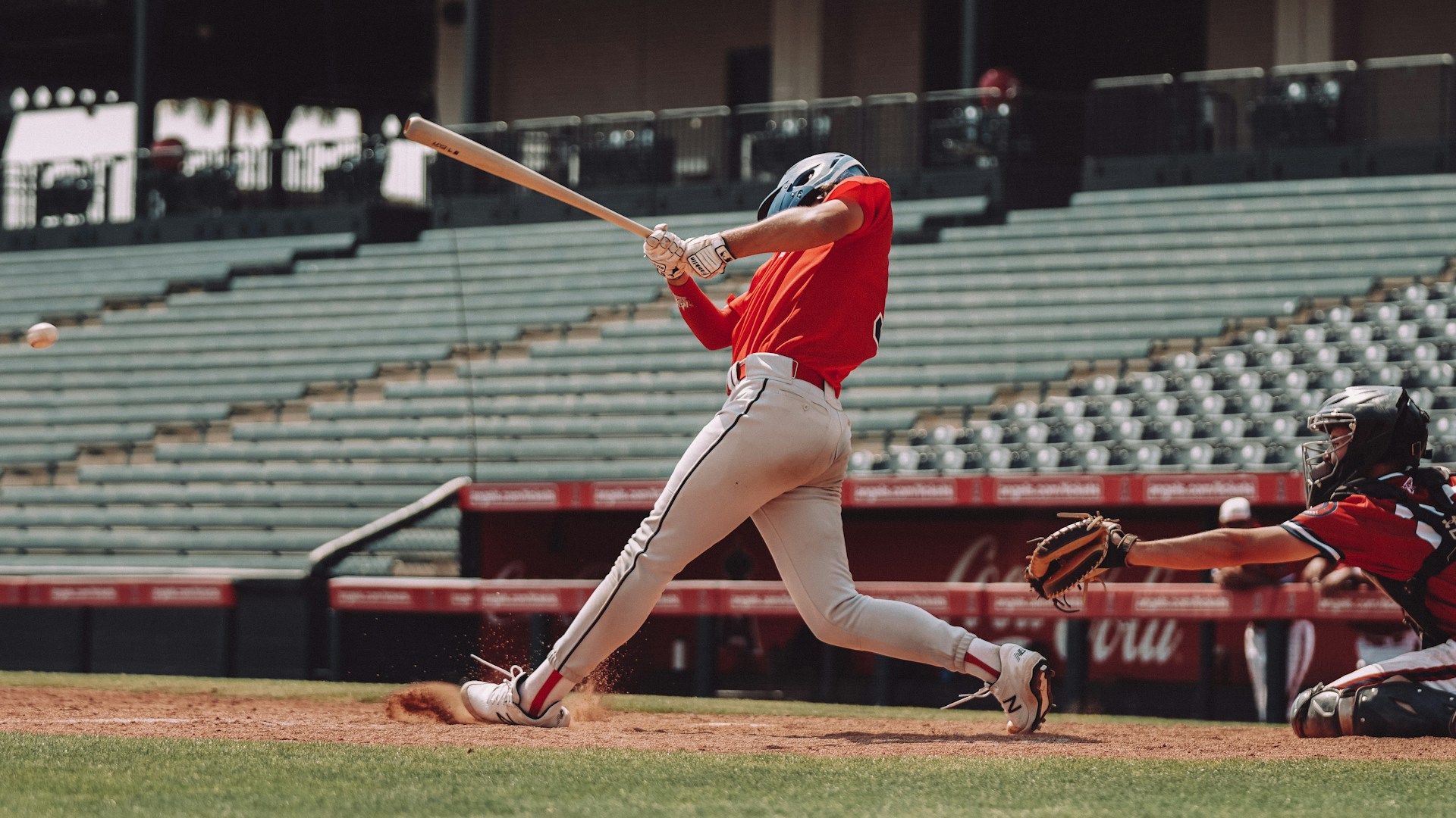 female ball player hitting a baseball