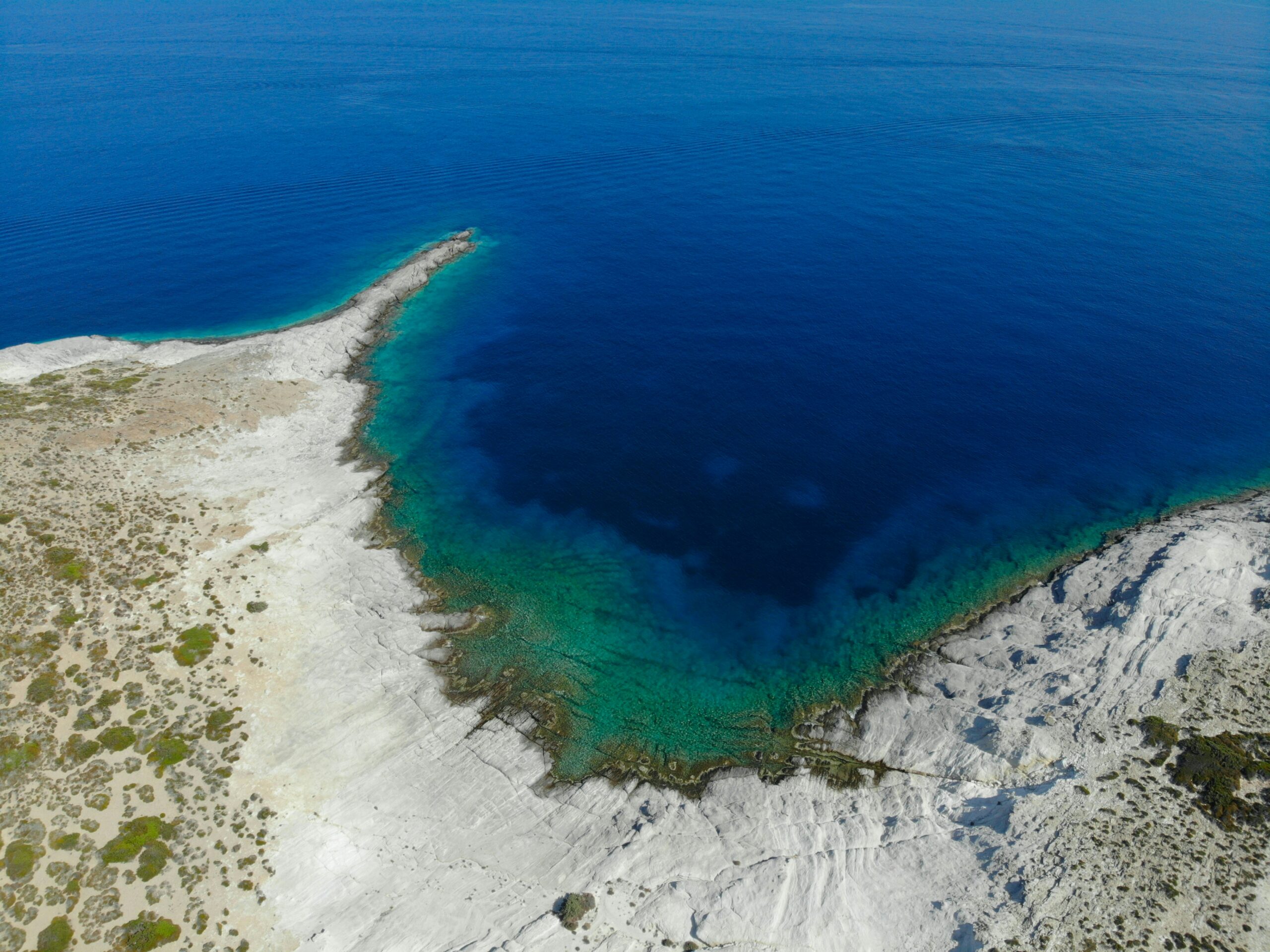 a stretch of beach seen from overhead on the isle of Antiparos in the Cyclades in Greece